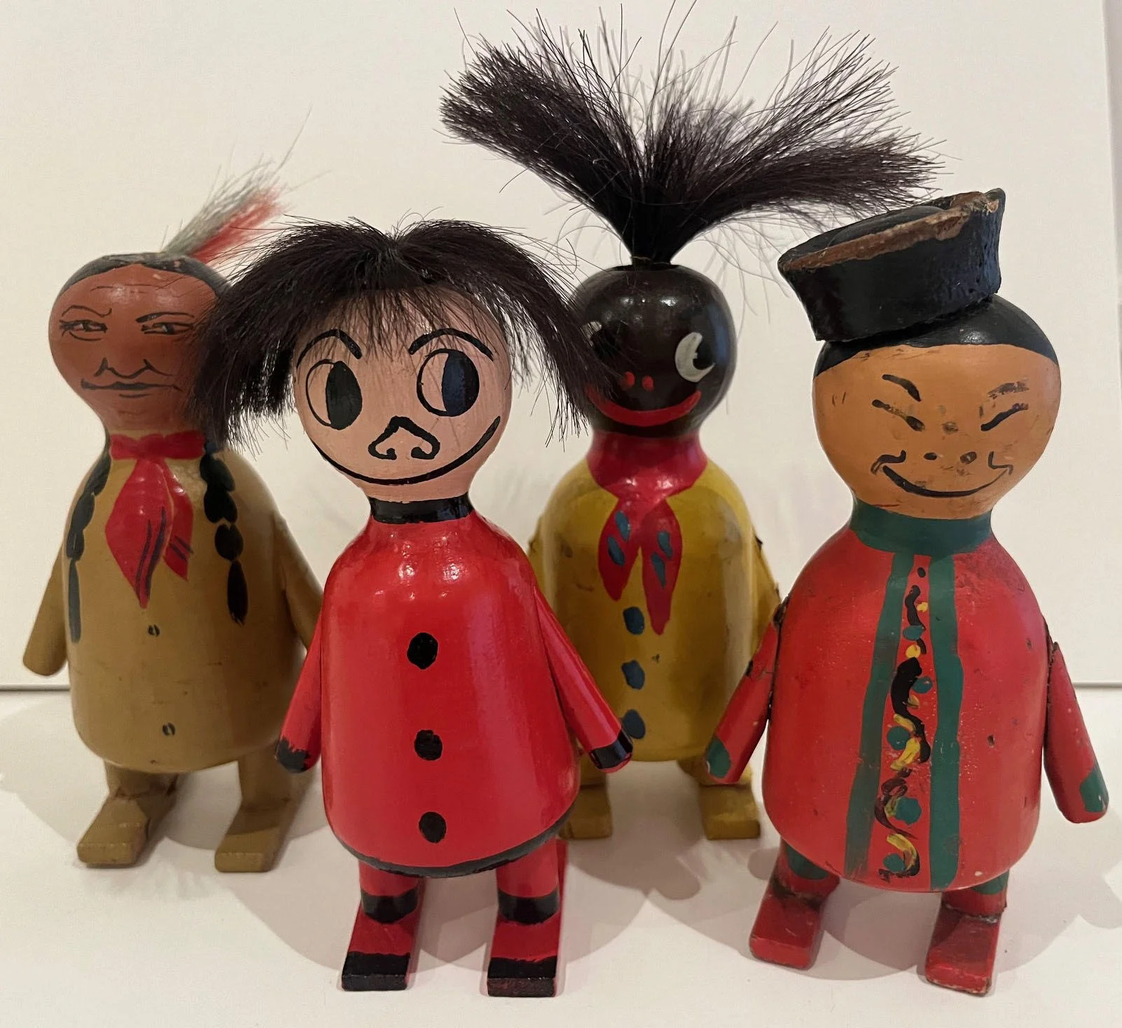  Four caricatured figures. Photo courtesy of Gene Metcalf.