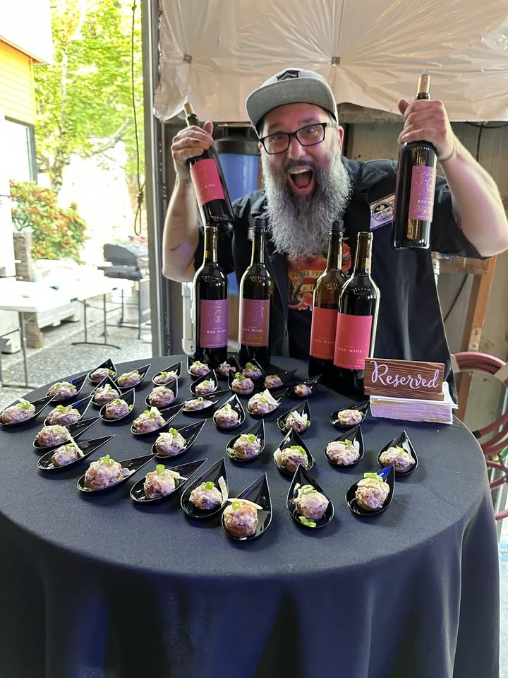 Tim with wine bottles.jpg