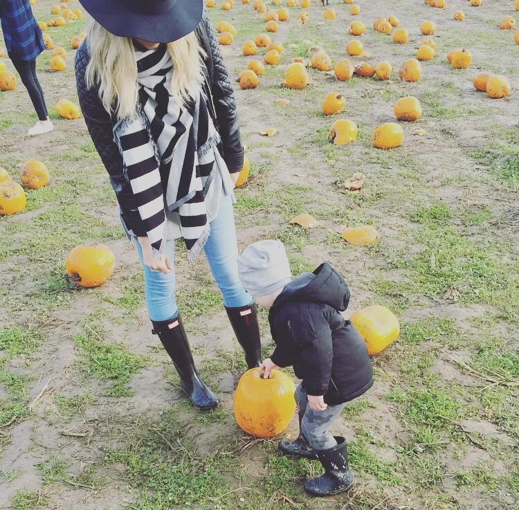 Picking out the perfect pumpkin together.