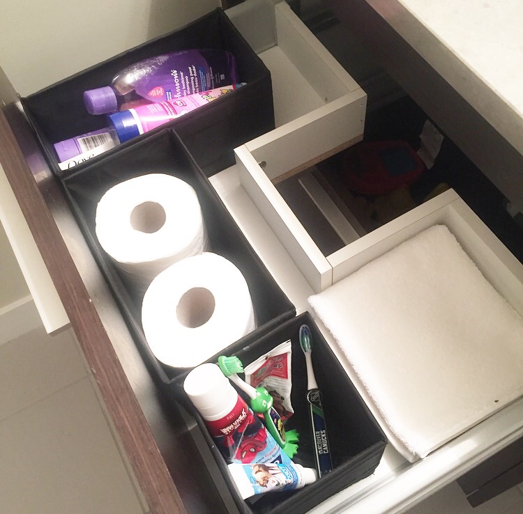 Lotion, baby shampoo, sunscreen, toilet paper, toothpaste + toothbrushes, and towels in the top drawer. 