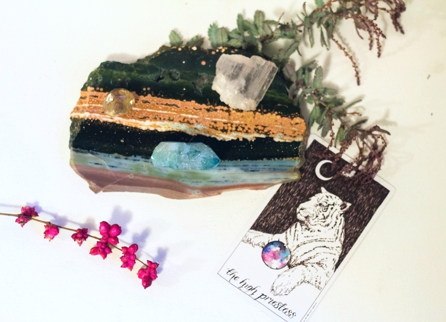 What I am Rocking (from L to R): Rutilated Quartz, Kunzite, Aqua Aura Quartz, and Ocean Jasper. The High Priestess, from The Wild Unknown Tarot , first edition