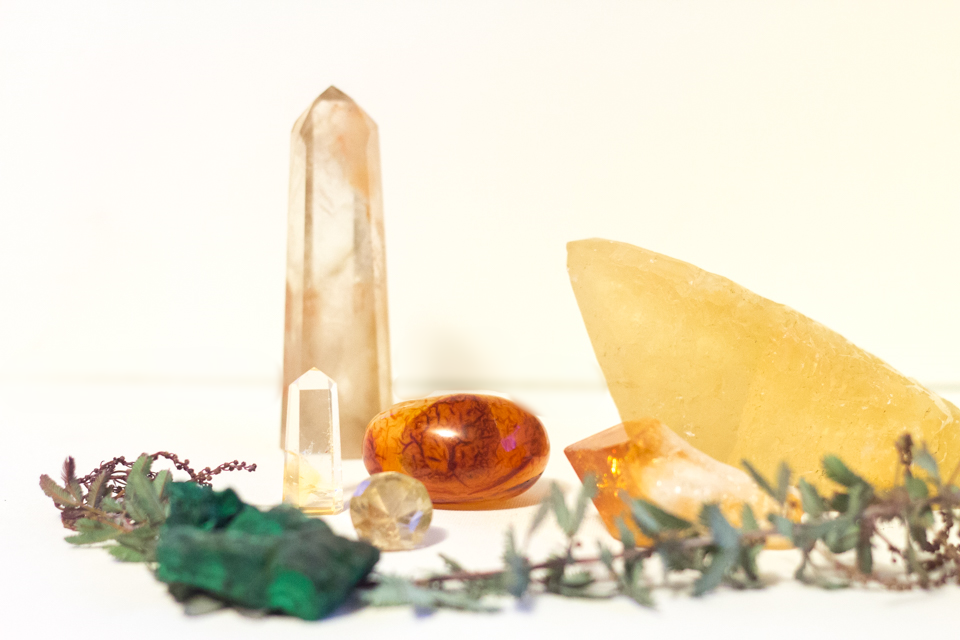 My little brainiac carnelian in the center. Surrounded by some other powerhouses, rutilated quartz (diamond shaped one), citrine (yellow and orange hued points), and lepidocrocite and iron included quartz (the tall dow, back left). Photo by the talented designer, Kate & Design