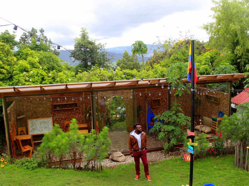 The deck sits behind the hostel and has a full bar, wood fire oven and a garden. 