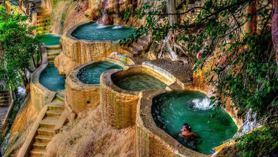 Swim in the heated pools on the side of the mountains. 