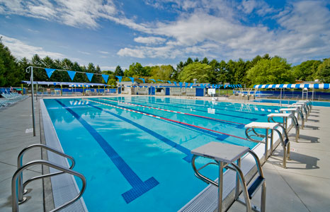 Outdoor lap pool with driving blocks at the Hill Farm Swim club in Madison, WI