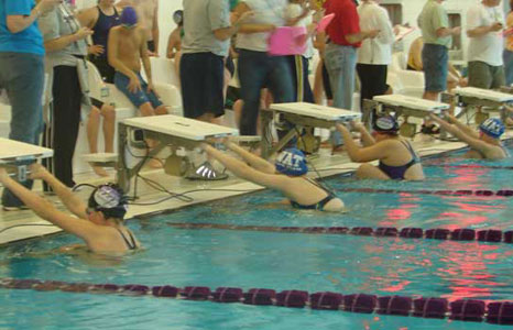 Swim team getting read to start a race in the lap pool at Waunakee High School in Waunakee, WI