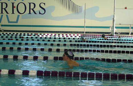 Swim team swimming during a race at Waunakee High School in Waunakee, WI