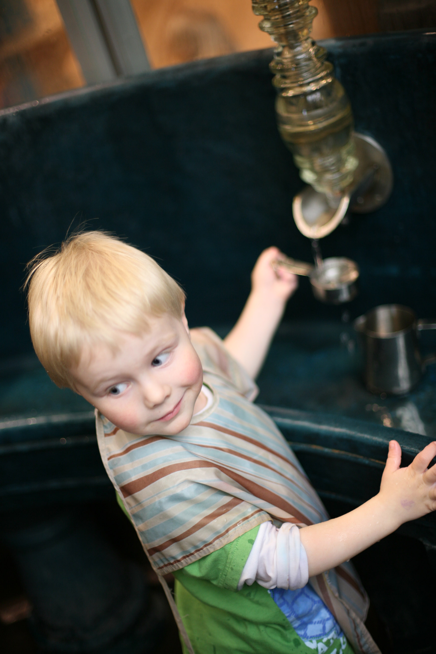 A kid participating in an exhibit at the Madison Children’s Museum in WI