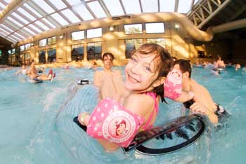 Kids playing in a wave pool