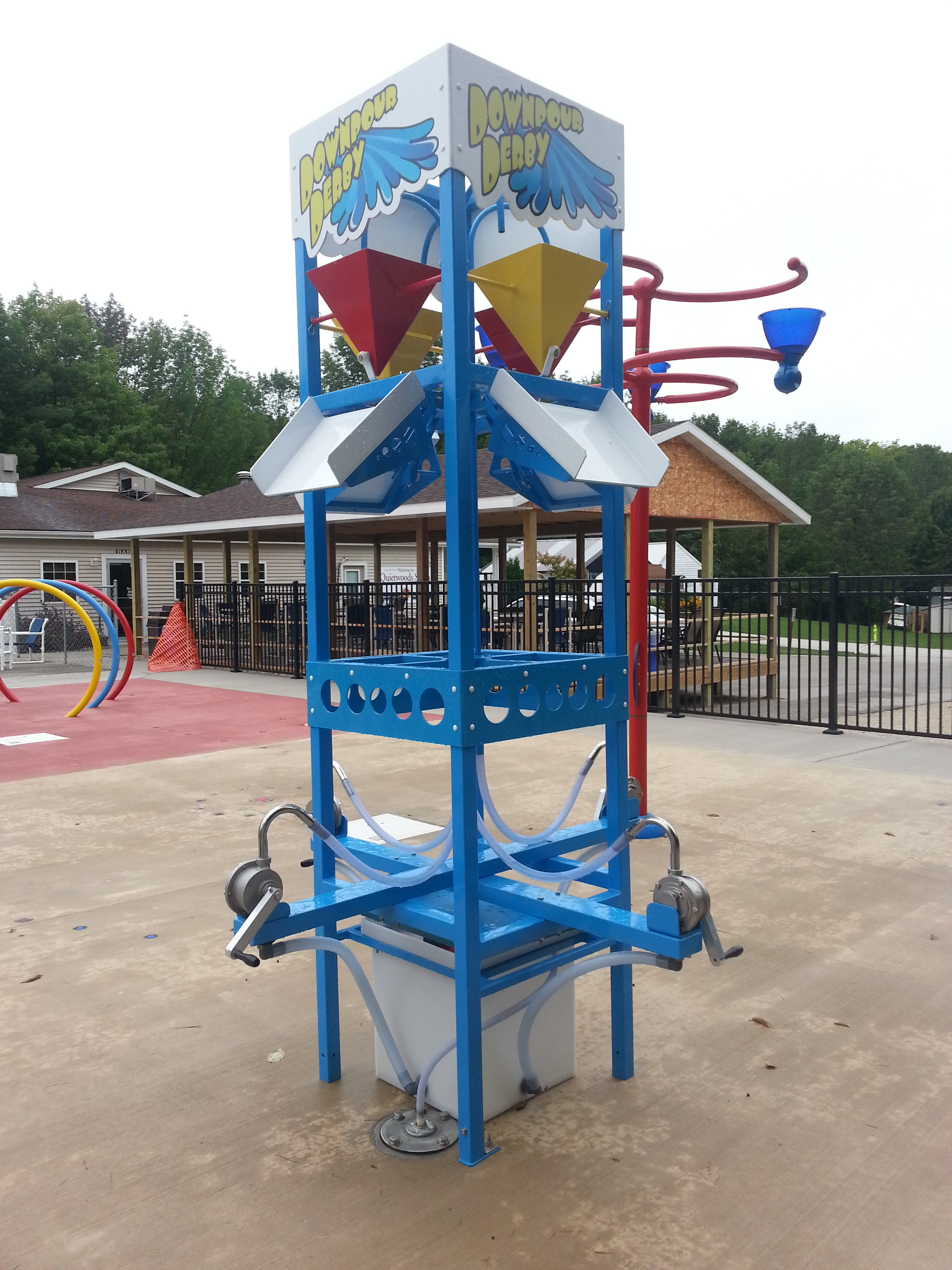 Outdoor plash pad water bucket dropper at Quietwoods South Camping Resort in Brussels, WI