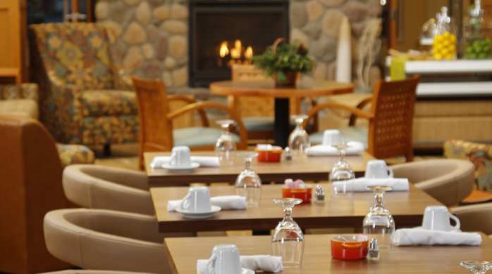Breakfast seating area in the Hilton Garden Inn in Cedar Falls , IA