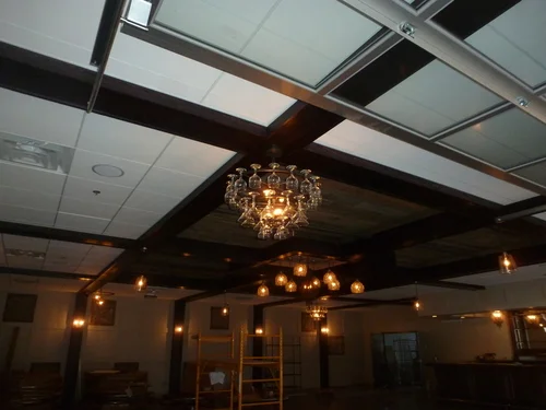 Hanging lights in O’Neil’s in Spicer, MN