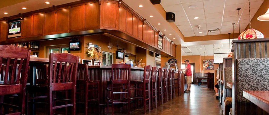 Bar and a seating area at Max’s Grill in Olivia, MN