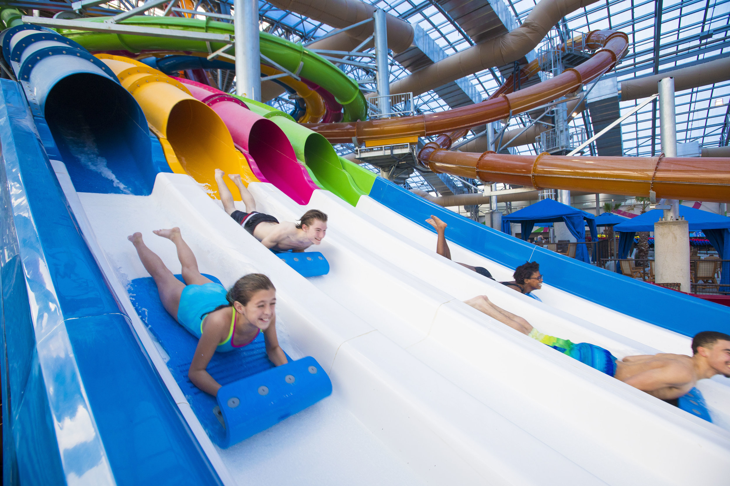 Kids racing down the mat racing slides