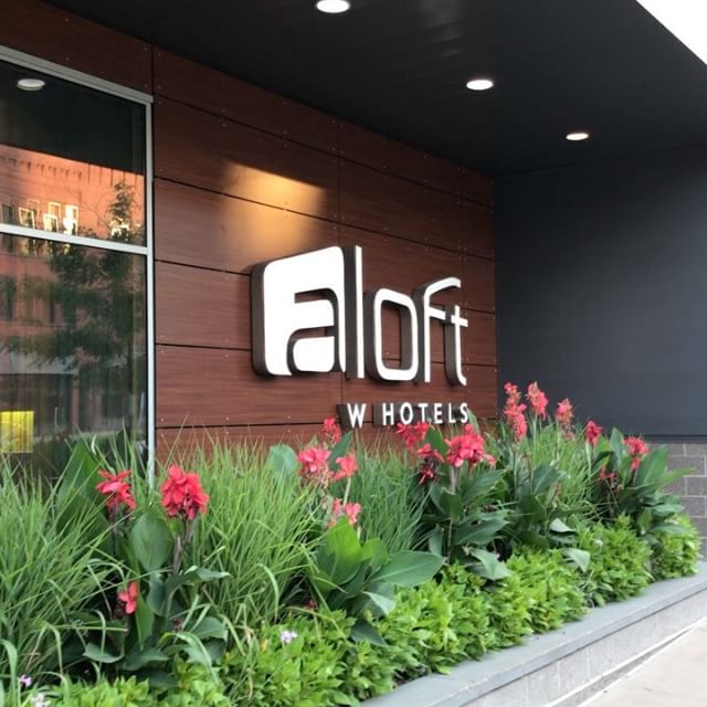 Sign of the hotel’s name on wall outside of the Aloft Hotel in Minneapolis, MN