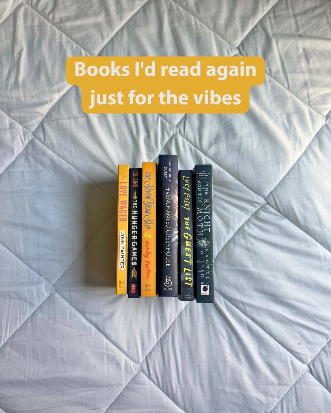 a stack of books on a white backdrop with text on the image that says "books I'd read again just for the vibes"