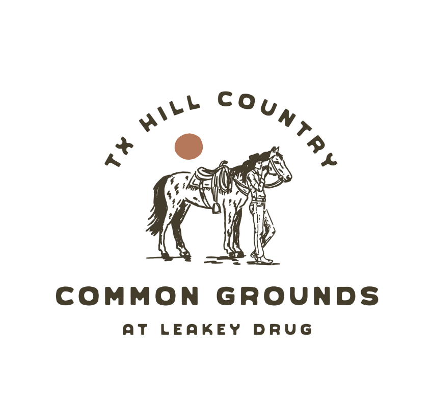 Cowgirl standing next to a horse in the logo