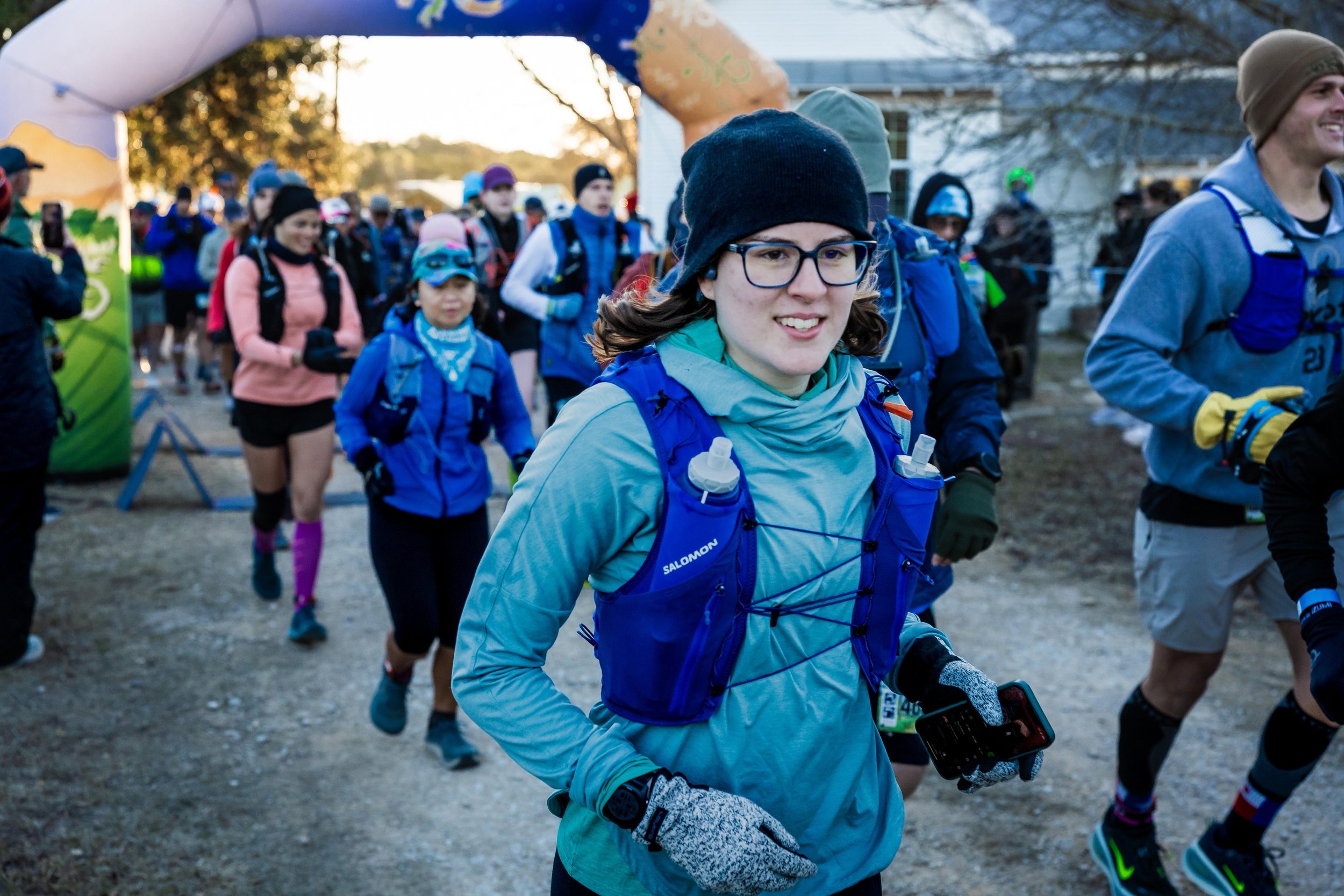Young female runner at Start Line, dressed for winter