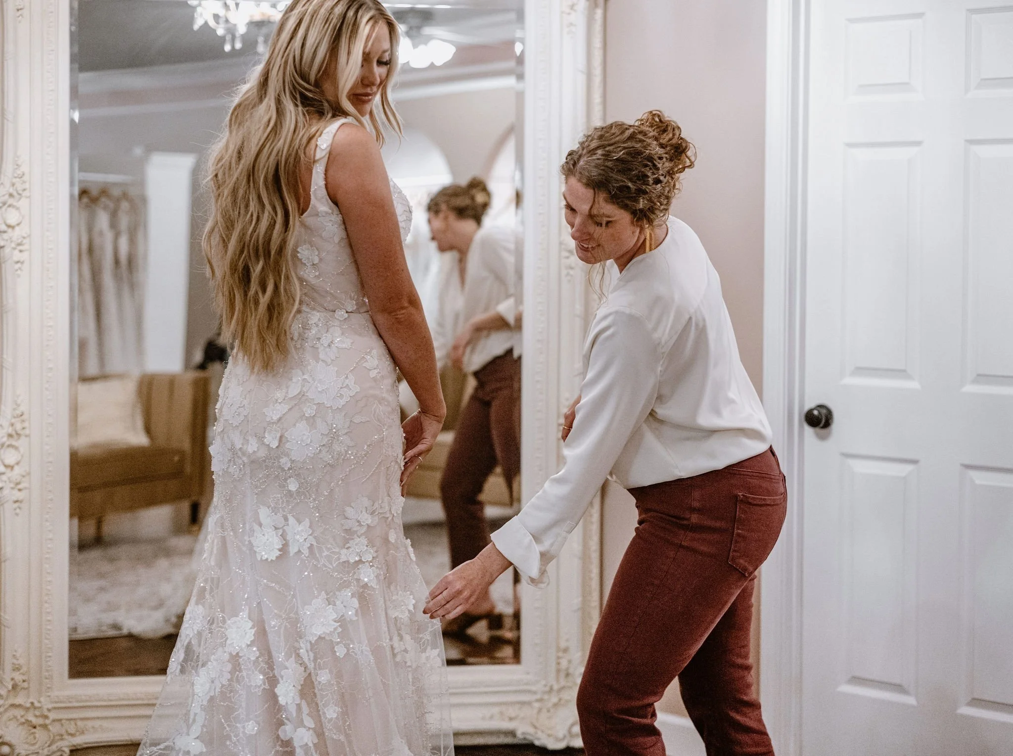 Bride Trying on Dresses at Couture Closet