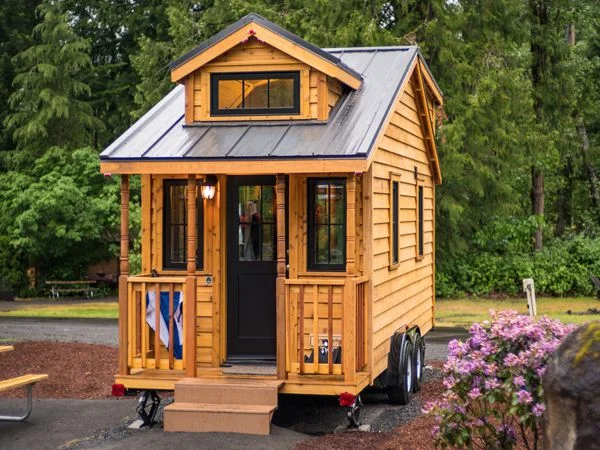 Housing in picture may appear smaller than actual apartment. (Image Attribution: https://www.mthoodtinyhouse.com/atticus_tinyhome)