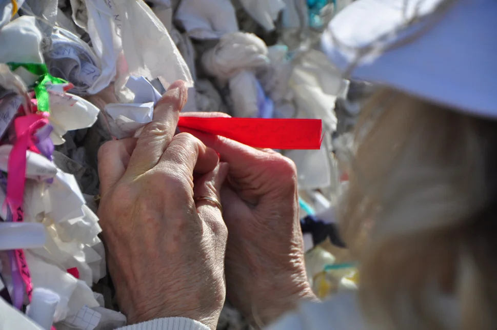 Hands_TyingMessageAtMarysWell_Web_082015.jpg