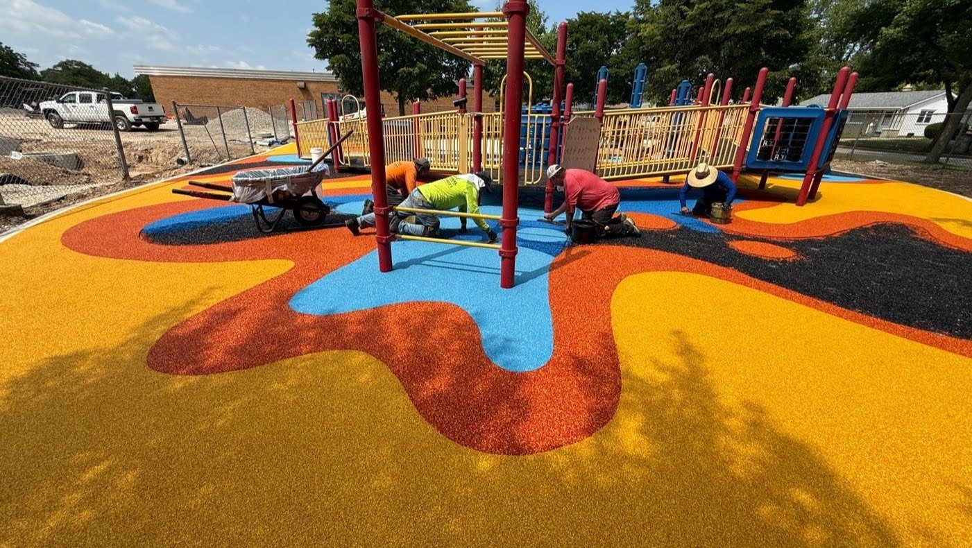  Installation of fun new Poured-in-Place rubber surfacing at Emerson School 