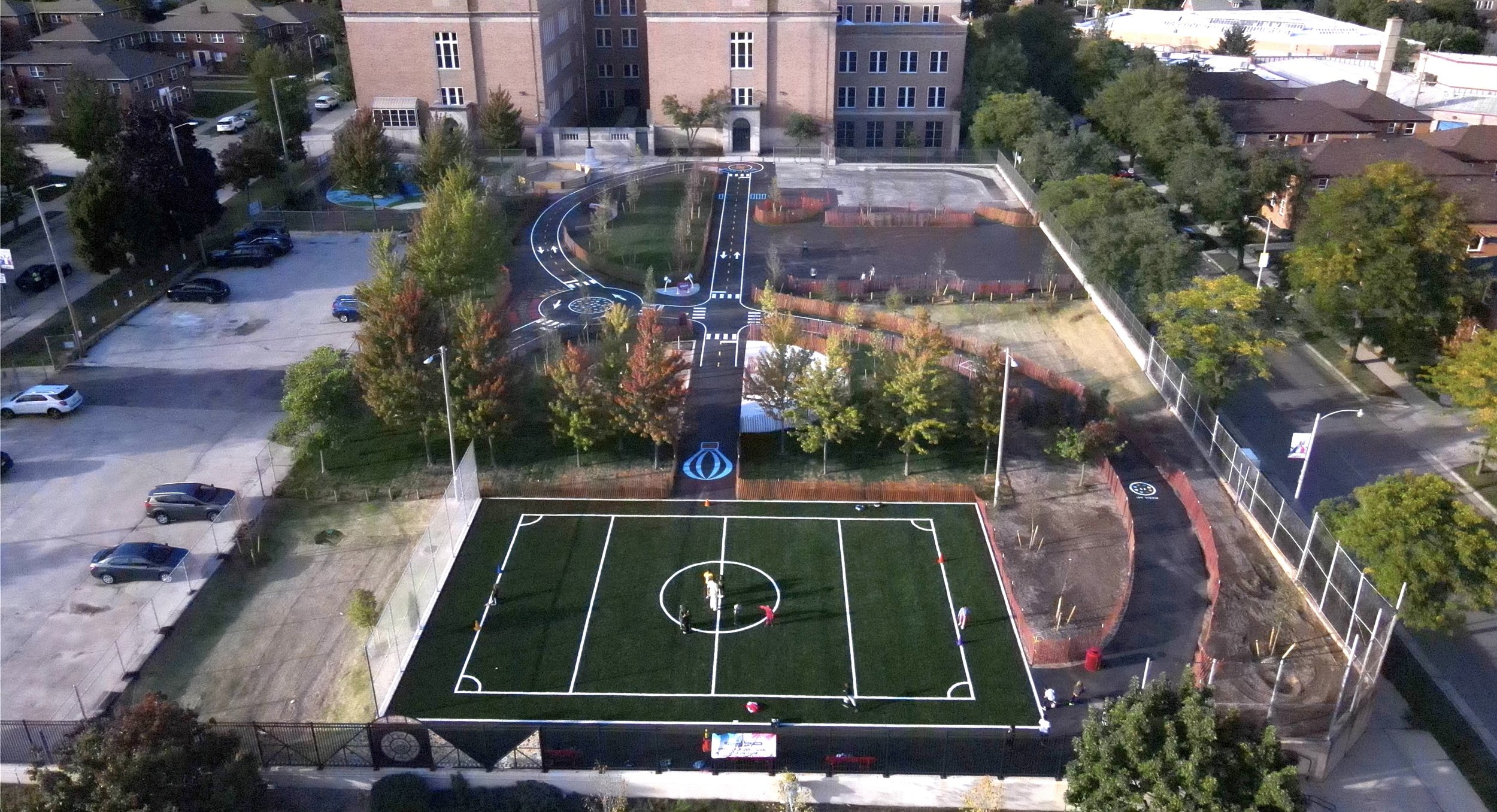  Milwaukee French Immersion Schoolyard redeveloped, using a portion of the parking lot to now have space for a synthetic turf field and bioswale with native plantings 