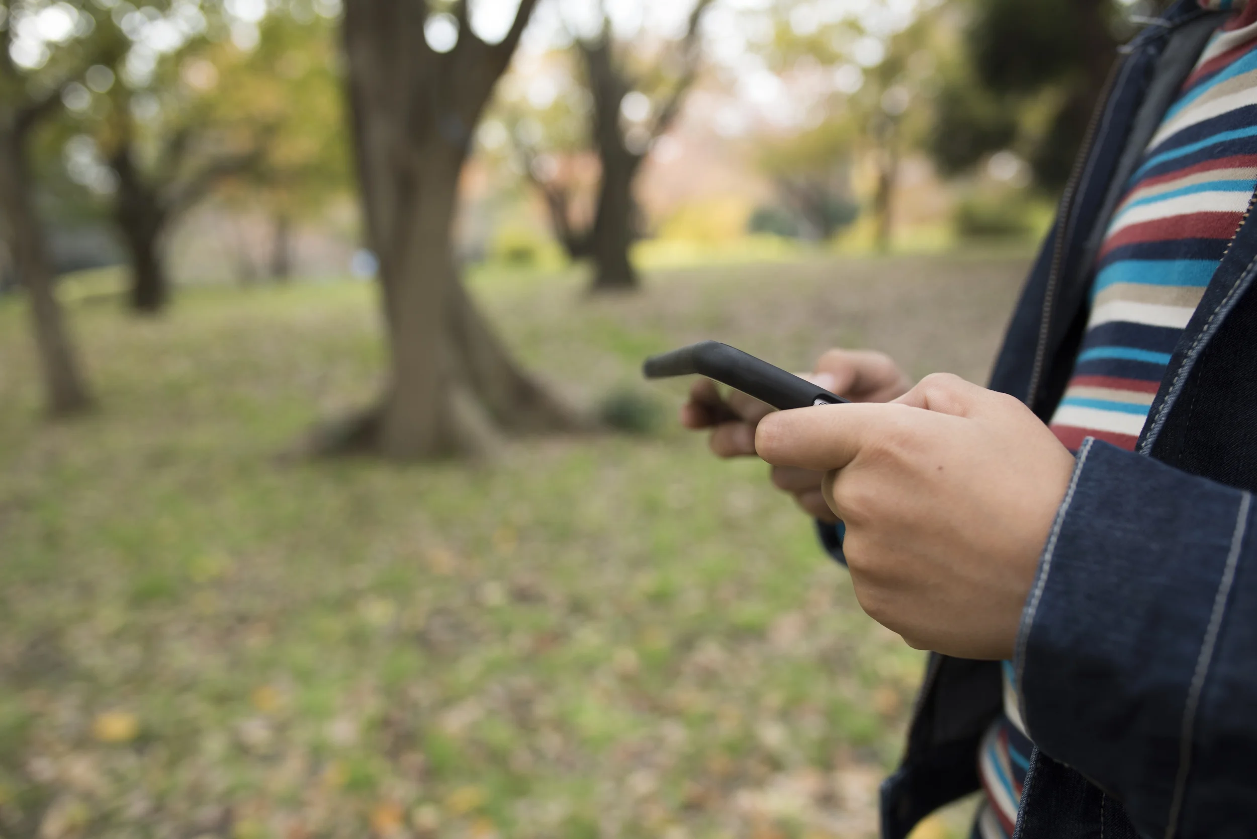 Hands in Park On Phone.jpg