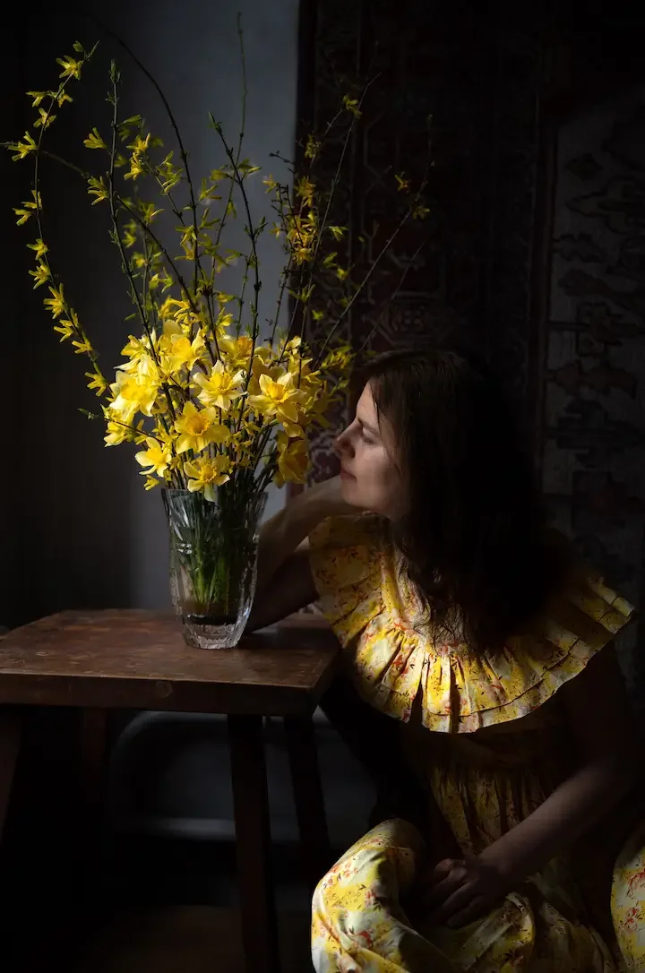 Alla Olkhovska portrait with yellow dress and yellow flowers