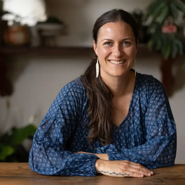 Emma Galloway headshot, wearing blue shirt.