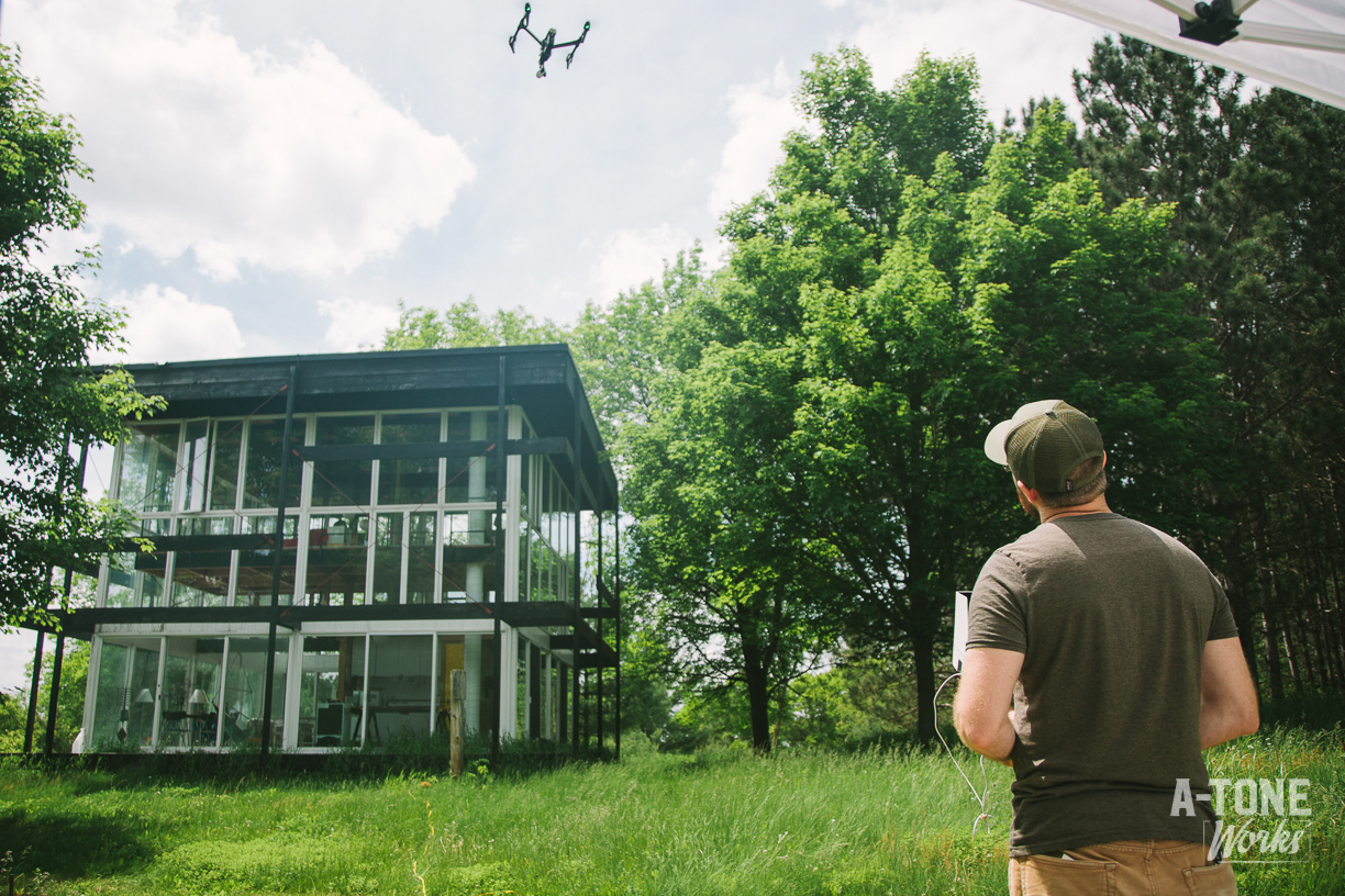 Corey flying a drone at the cube, Day 1 of Rapson Cube project