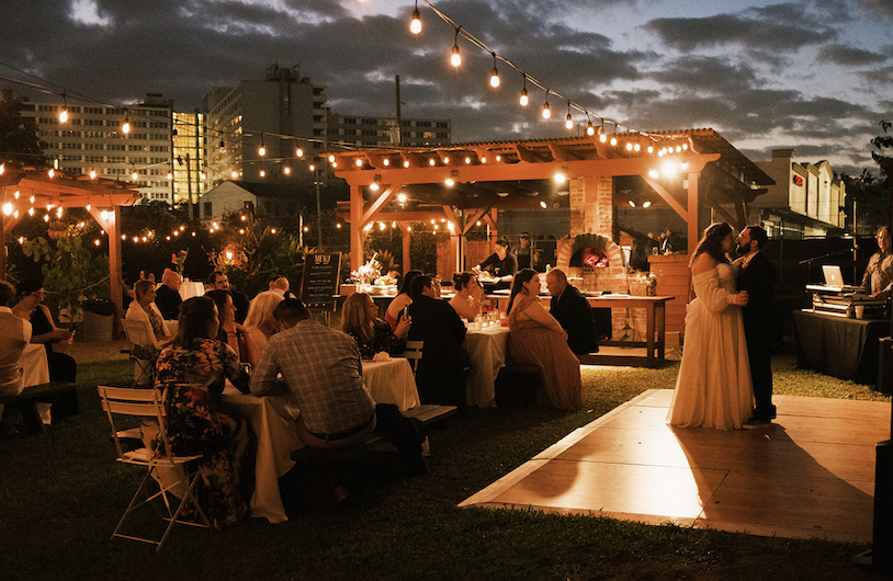 A couple dancing in front of their guests at Paradigm.