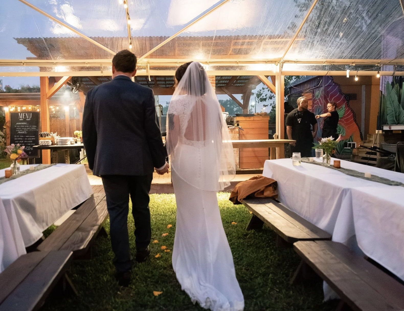 A clear tent used as a weather contingency plan during at Paradigm Gardens, an outdoor garden venue in New Orleans.