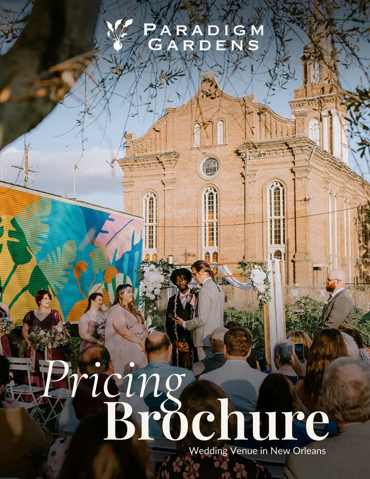 Cover image for wedding venue pricing brochure depicting a couple getting married in a garden with a church in the background.