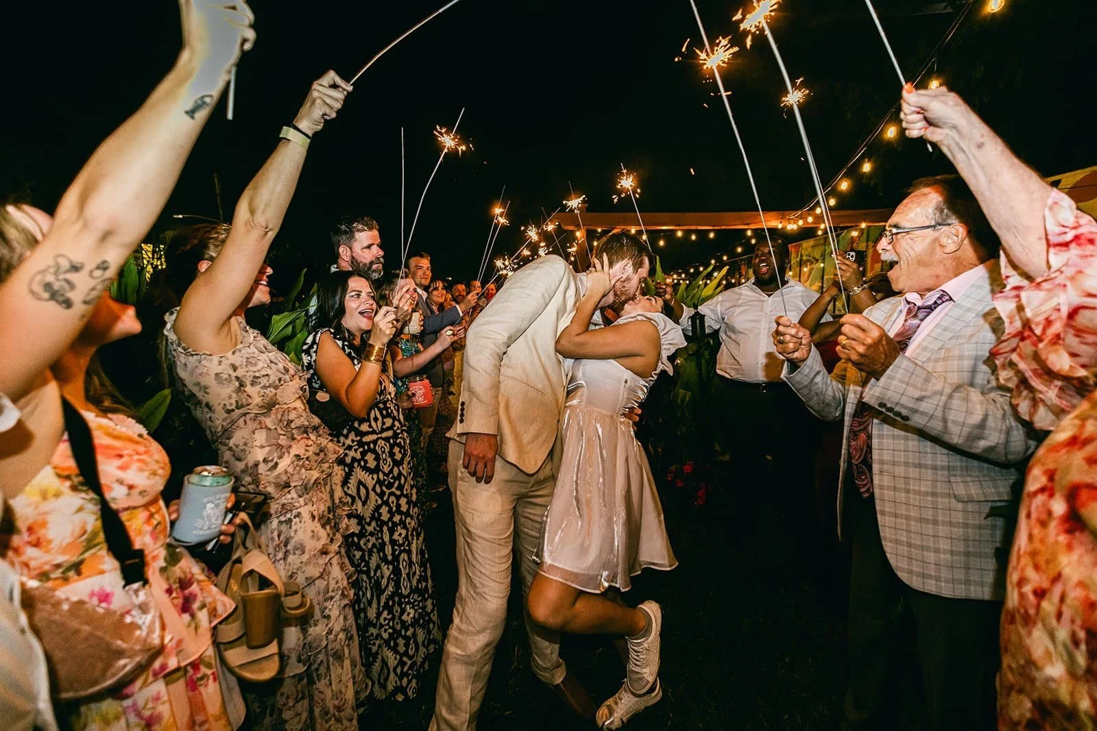 Bride and groom sharing a kiss at Paradigm Gardens outdoor wedding venue New Orleans