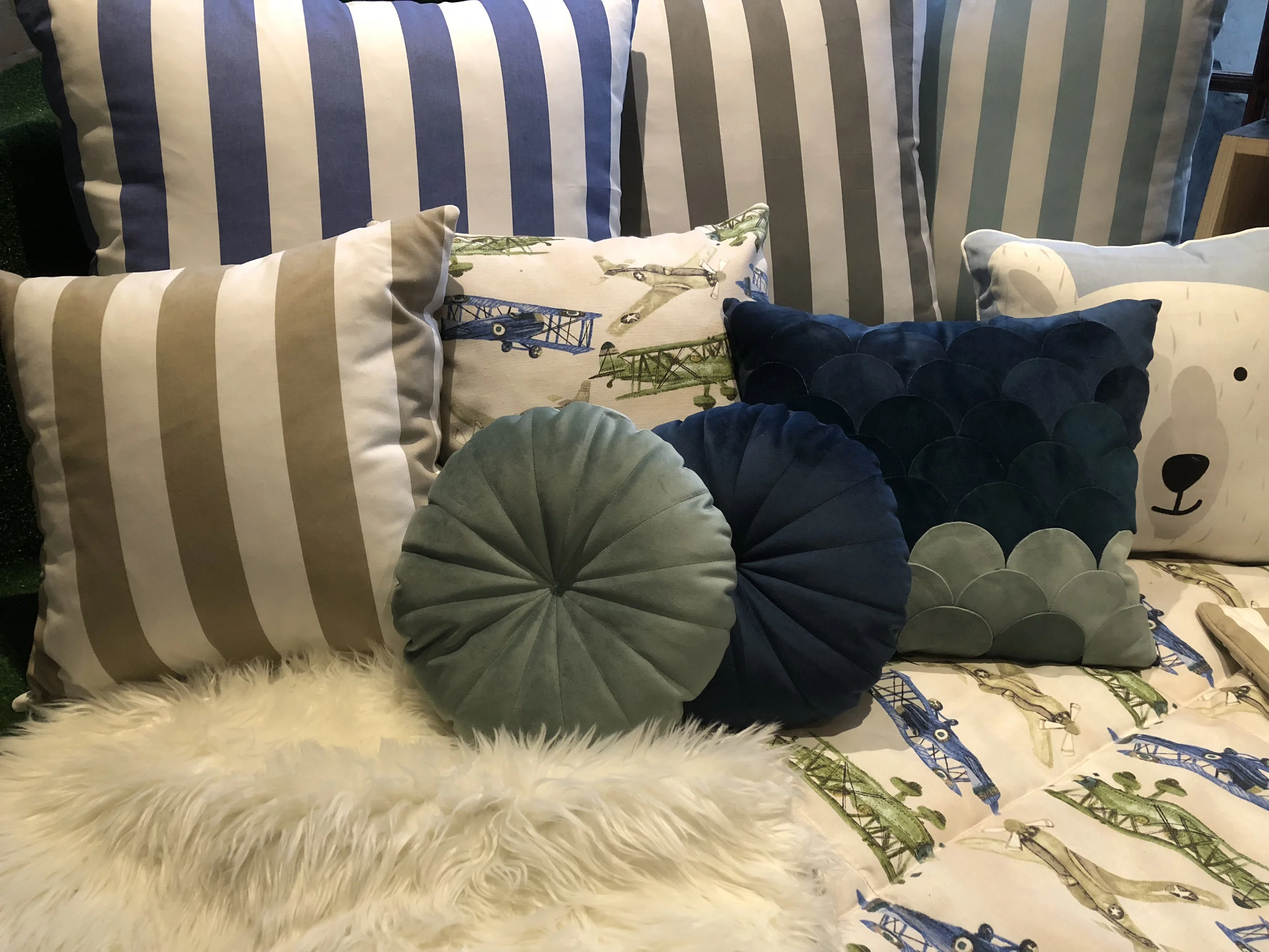 Handmade boys’ playroom soft furnishings in blues and greens by Tassels & Tigers Interiors