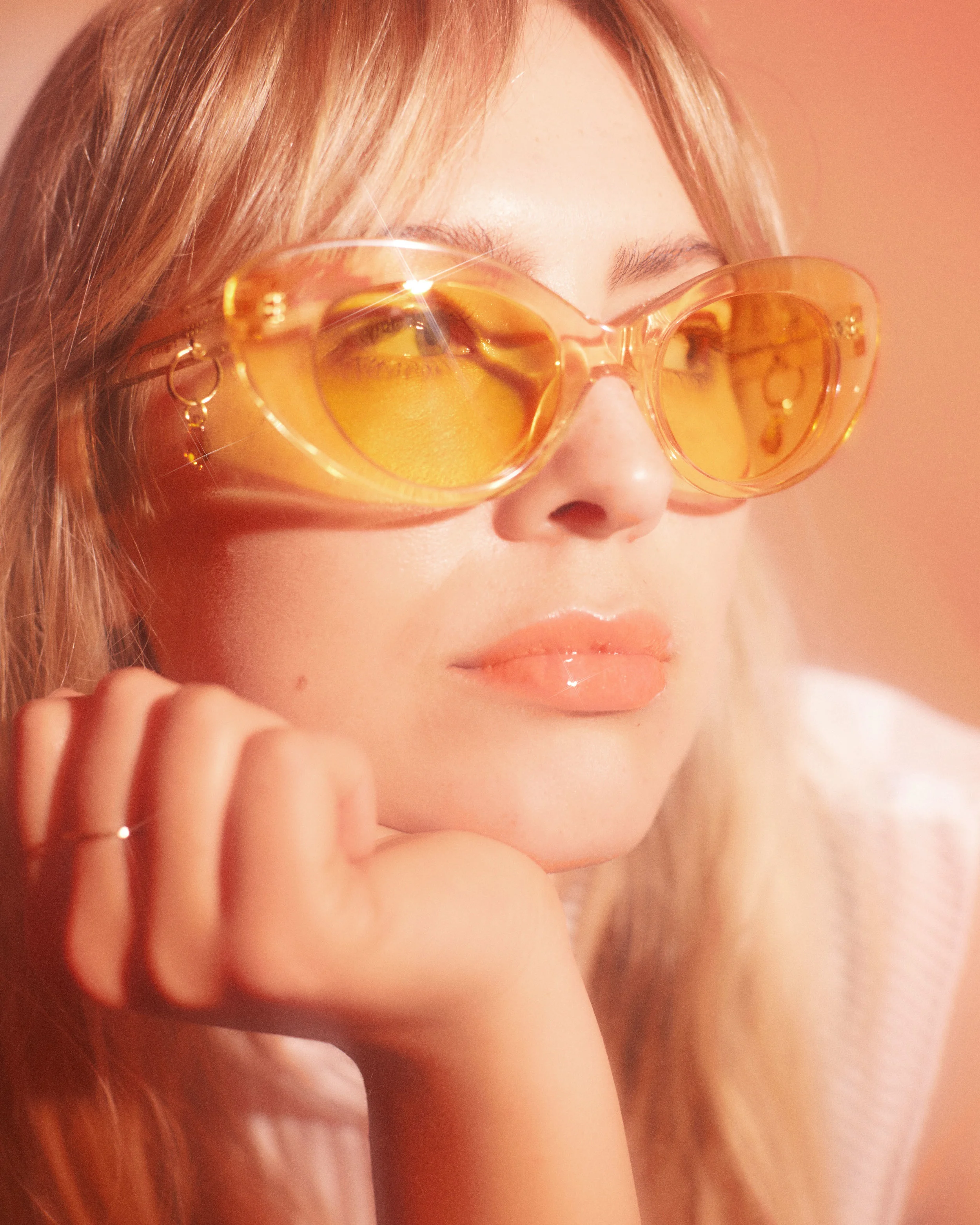 Genevieve wears the POMS x Pared Gatto shades from Monk House Design and the Pageant Situate top.