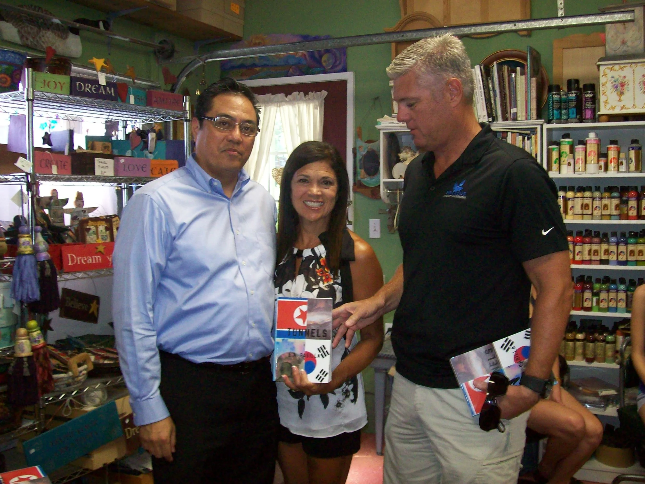 Theresa & Tony Yoder with book.JPG