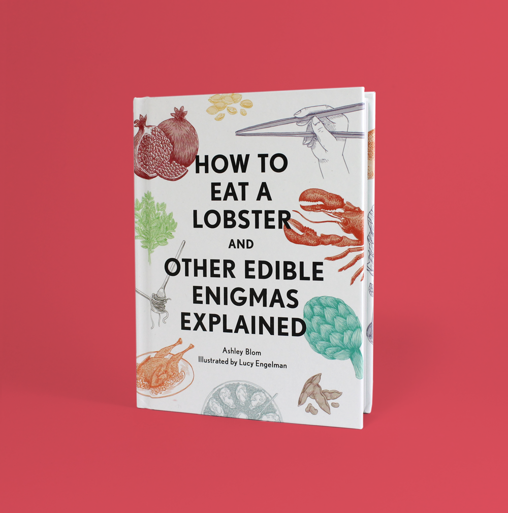 Book titled "How to Eat a Lobster and Other Edible Enigmas Explained" with illustrations of a pomegranate, a bunch of parsley, a chain, a lobster claw, and other food items by Lucy Engelman on a white cover, set against a pink background.