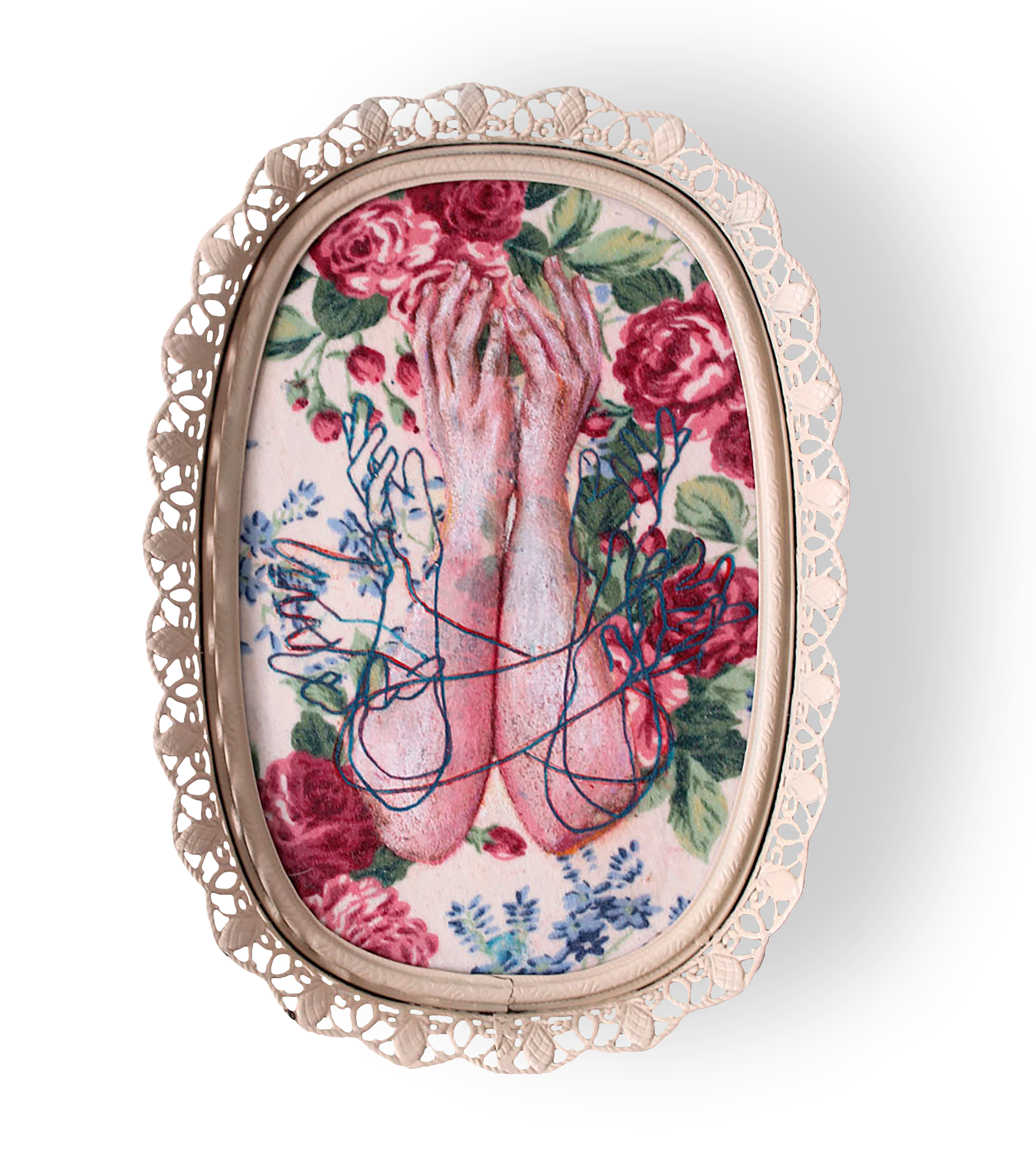 An oval mixed-media piece on floral fabric featuring painted hands overlayed with blue outlines of hands, in a vintage metal filigree frame. Art by Laura Shull.