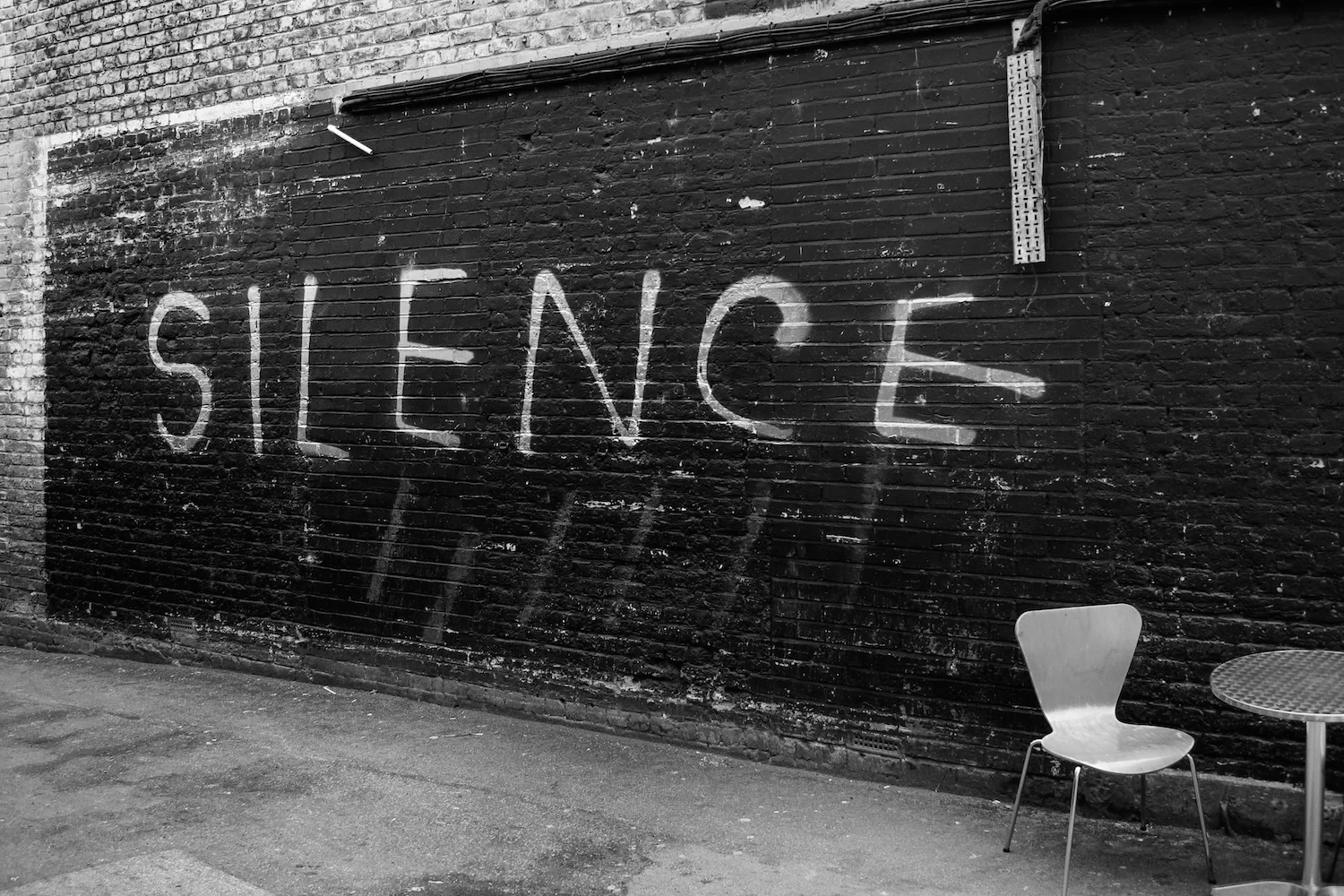 Silence is golden – cafe wall, London.