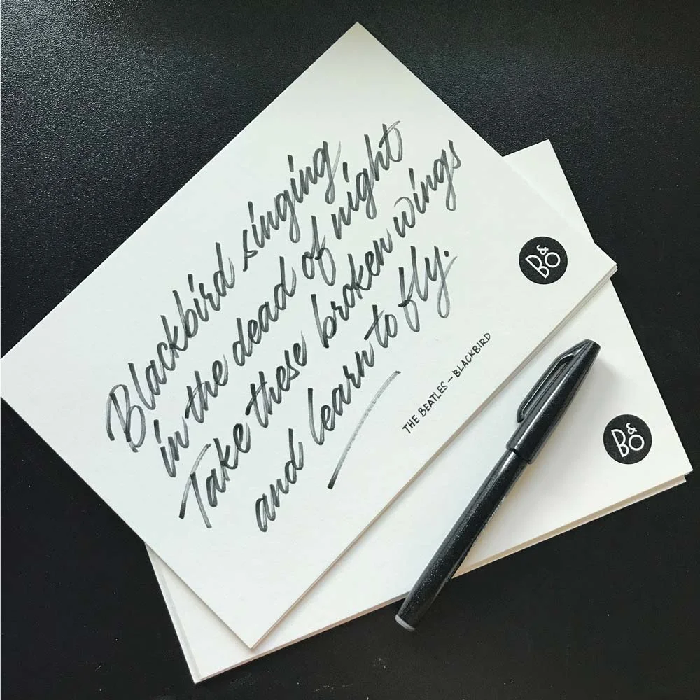 Hand written lyrics on card stock