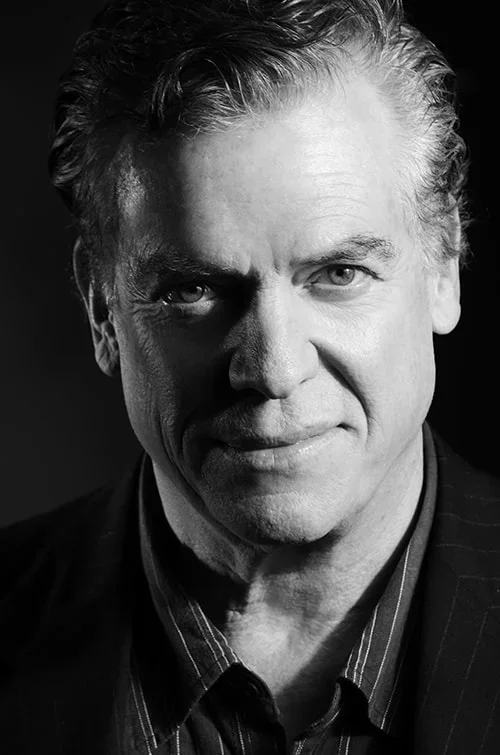 Black and white headshot of  Chris McDonald 