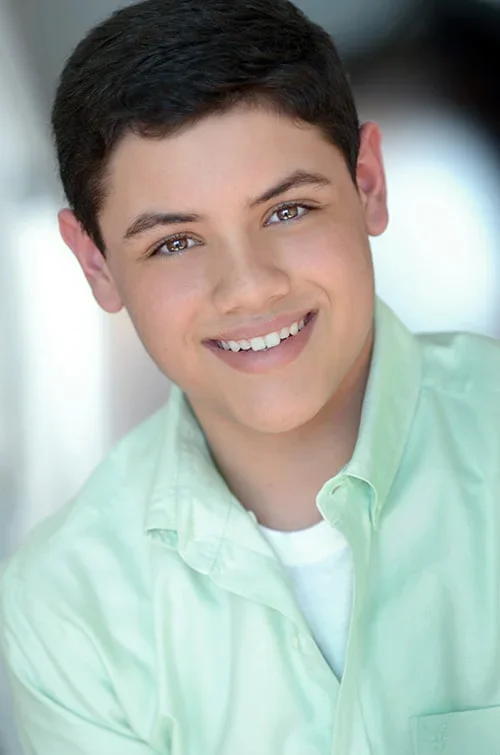 Kid in green shirt headshot