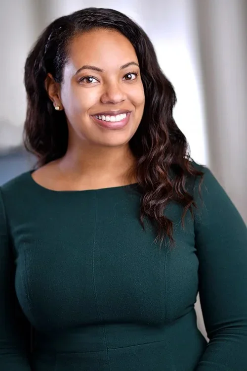 Headshot in a green shirt 