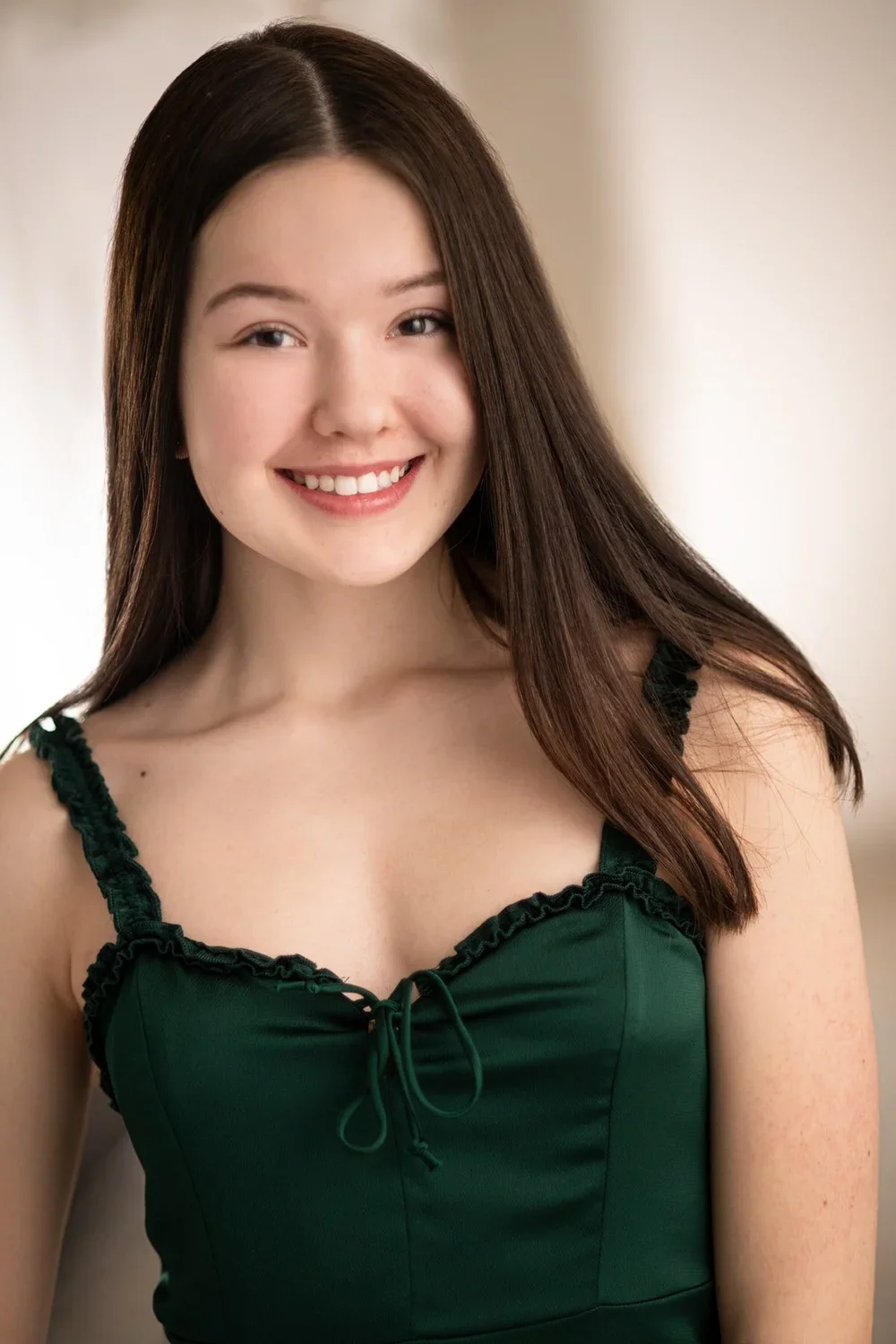Teen in green shirt headshot
