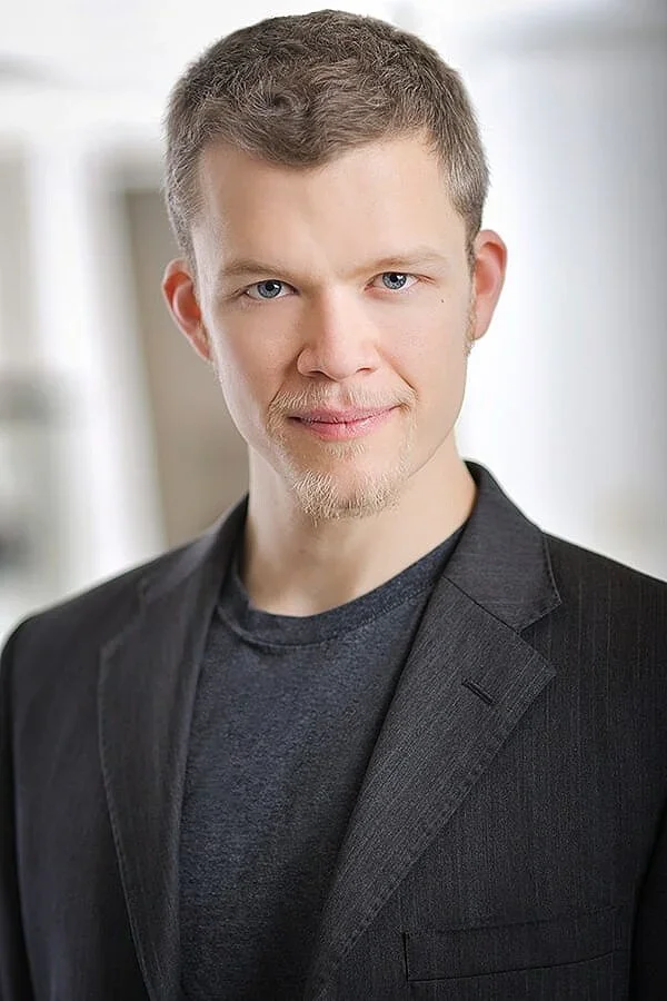 Male in dress jacket headshot 