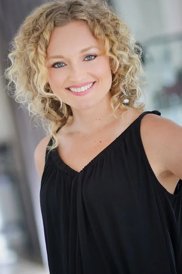 Blonde woman in black shirt