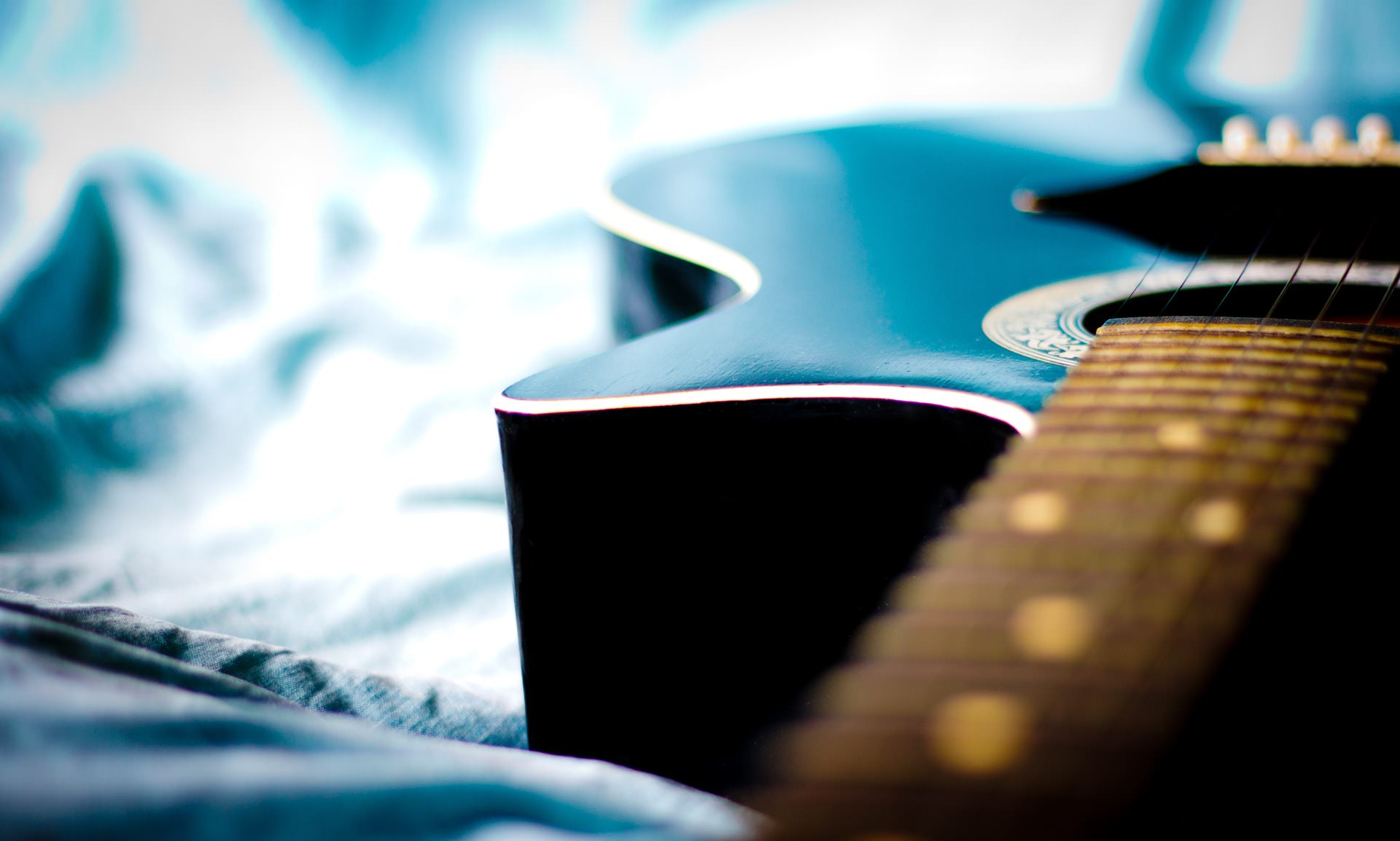 Guitar in Bed.jpeg