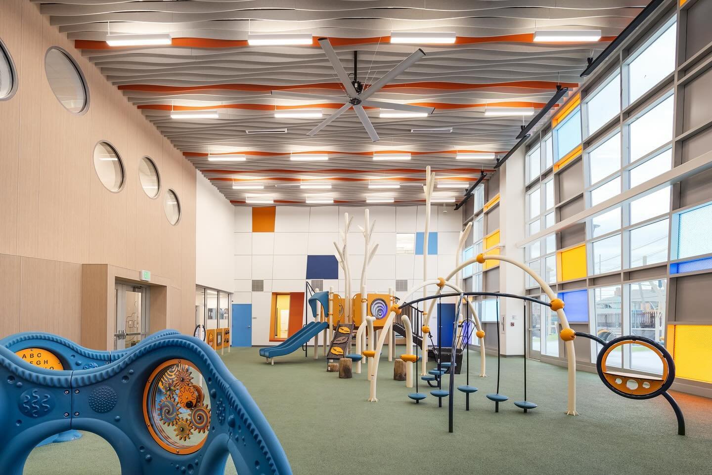 The indoor playground at the Hilltop Early Learning Center has visual connections into  the classrooms with low windows as well as circular windows in the second floor corridor at varying heights focusing on a child&rsquo;s viewpoint.
&bull;
&bull;
&